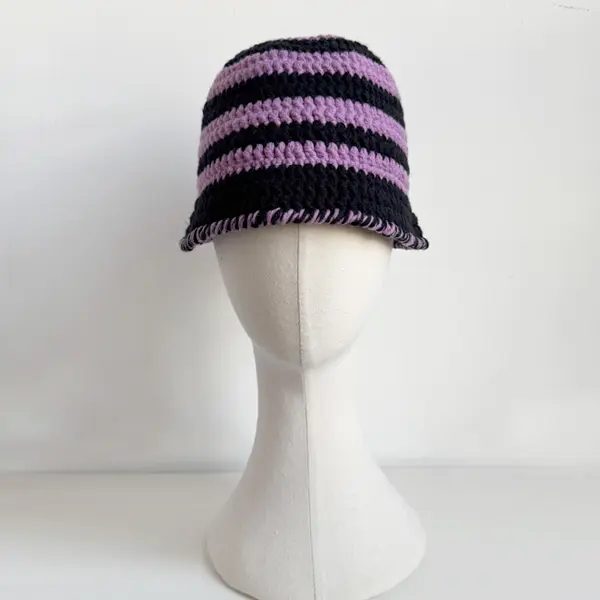 Girl wearing AliveNana handmade crochet hat, cozy and cheerful style