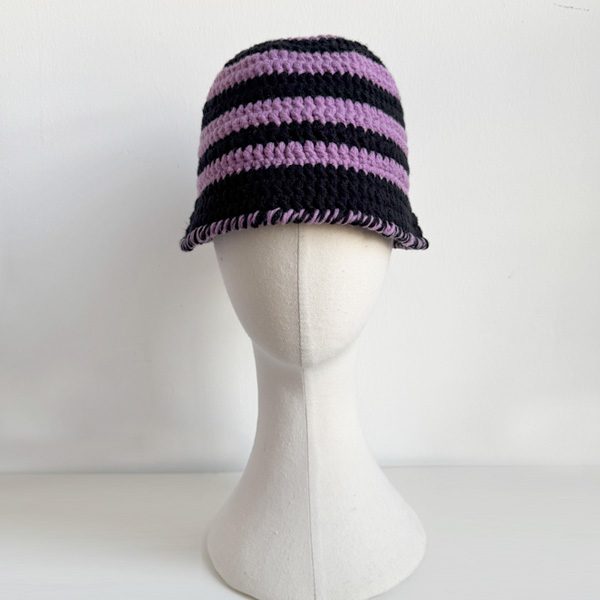 Girl wearing AliveNana handmade crochet hat, cozy and cheerful style